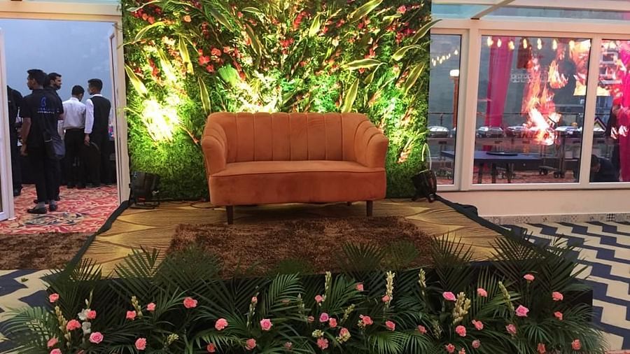 A sofa placed on a decorated podium - The Orchid Hotel Shimla