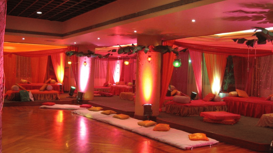 Ambient lighting at a banquet hall in The Retreat Hotel and Convention Centre, set up for an event.