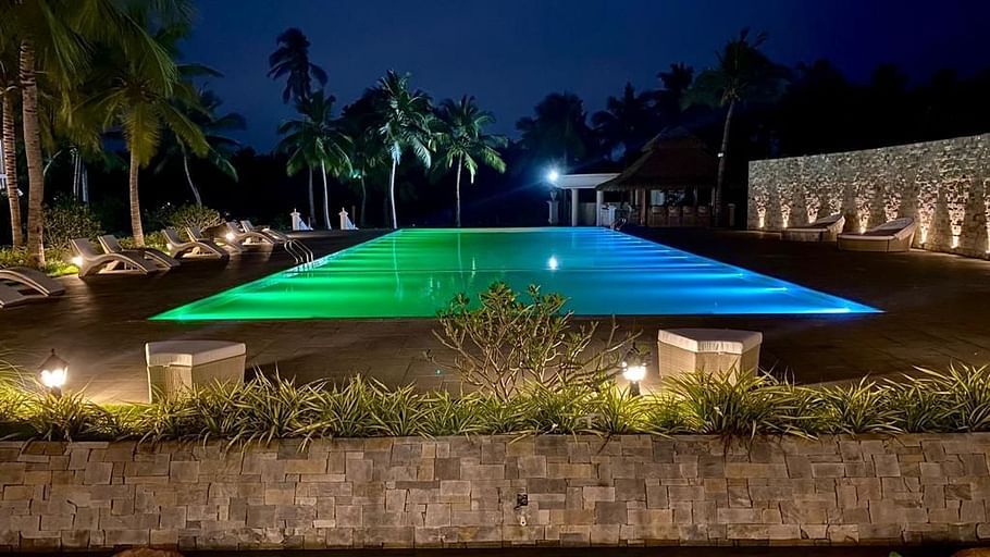 infinity pool lit up at night
