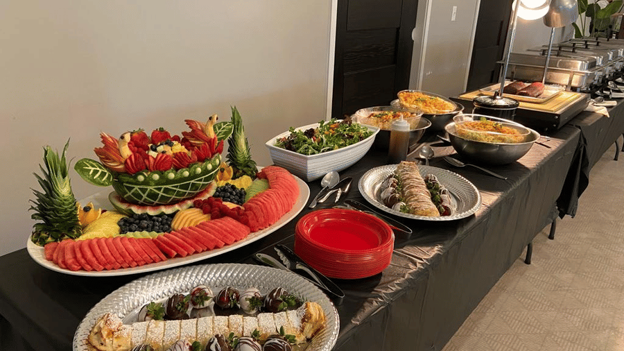 Fruit platter and assorted healthy food along with salads on a buffet table at YO1 Longevity & Health Resorts, Catskills
