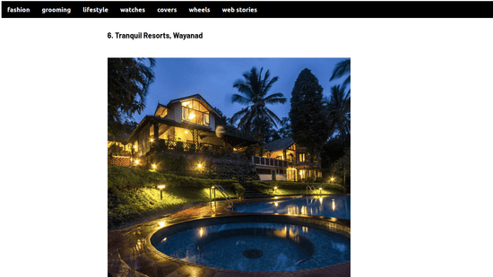 A Man's World lifestyle article featuring an illuminated resort villa next to an outdoor swimming pool at dusk at Tranquil Resort, Wayanad.
