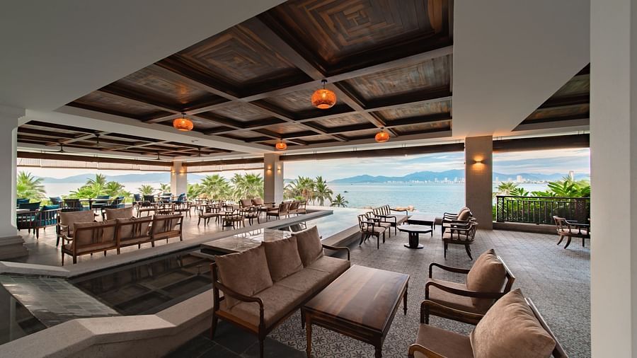 An image of a huge sitting area of with several chairs and centre tables - Alibu Resort Nha Thrang