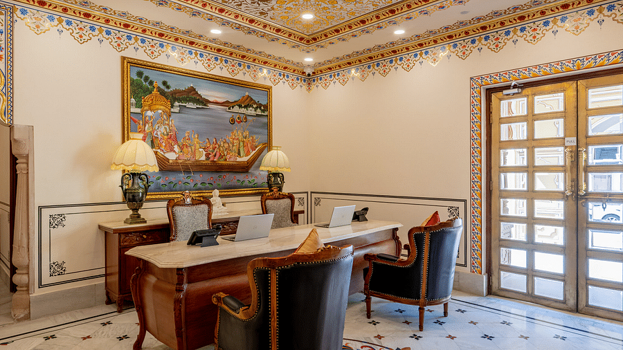 corner view image of the reception area with a beautiful mandala design engraved on the floor - Brij Castle, Jaipur