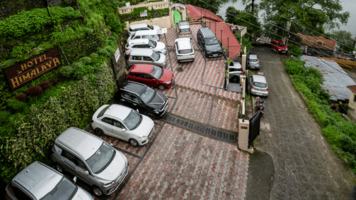Cars parked at the parking place at Himalaya Hotel, Nainital