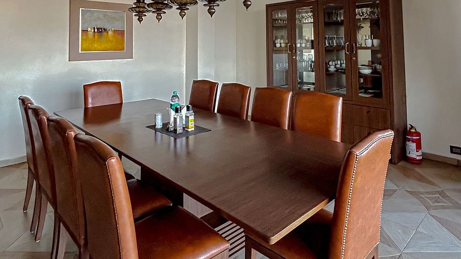 Stylish bar and kitchen area with high stools and modern finish at Aranya Retreat, Mashobra.