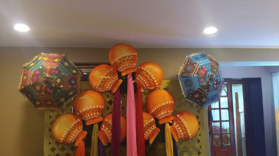 Beautiful indoor decoration with bright, festive umbrellas and elegant drapery at Central Courtyard Boutique Hotel.