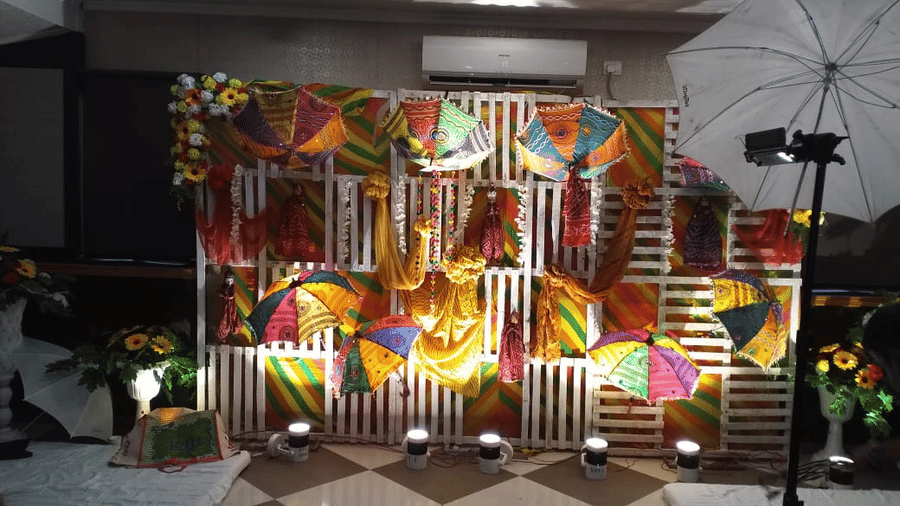Stunning stage backdrop with colourful patterns, drapes, and warm lighting at Central Courtyard Boutique Hotel.