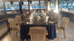 Elegant dining setup with wooden chairs and table arrangements at Fantasy Golf Resort.