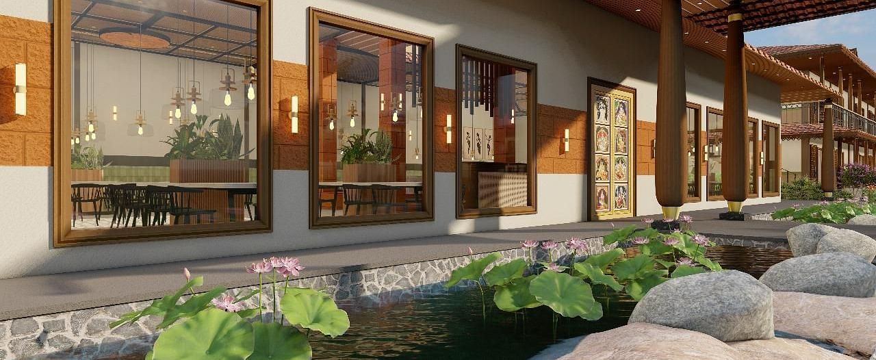 Exterior view of a resort building with a pond and rock landscaping | Ayana Resorts & Convention, Hyderabad