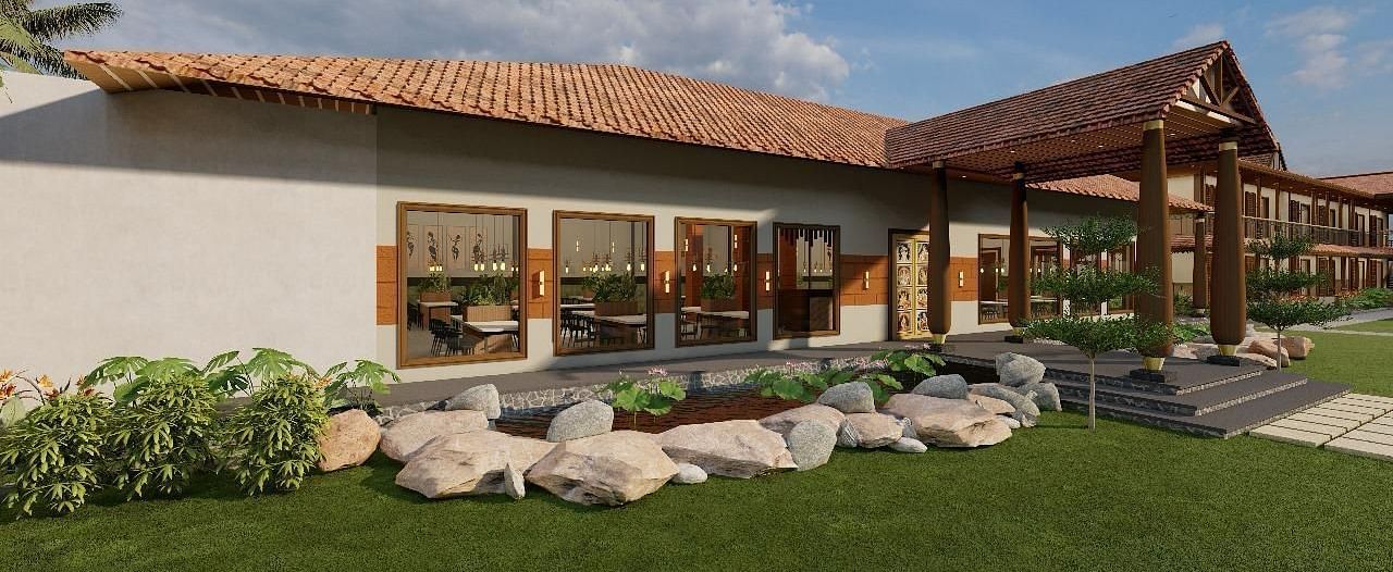 Exterior side view of a resort building with a lawn and garden | Ayana Resorts & Convention, Hyderabad