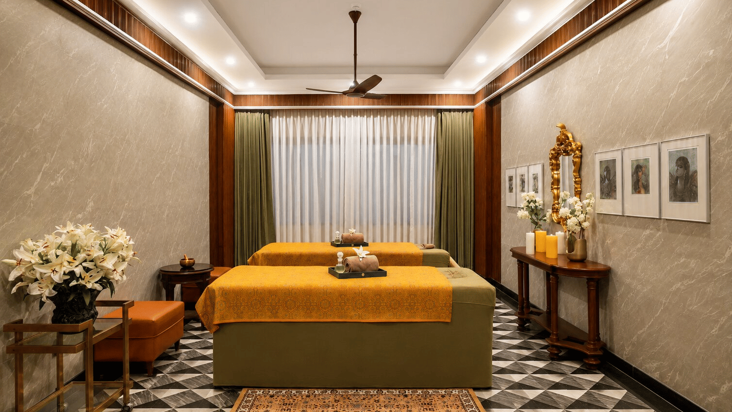 2 therapy beds with yellow linens and fresh flowers inside the Spa at MAYFAIR Bay Resort, Paradeep.