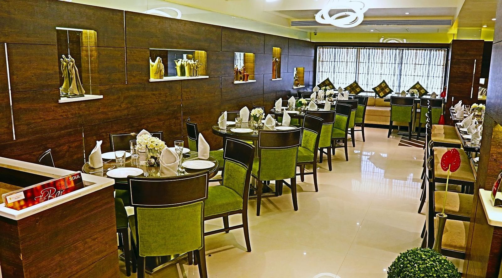 Image of dining space with tables and chairs at The Oriental Residency