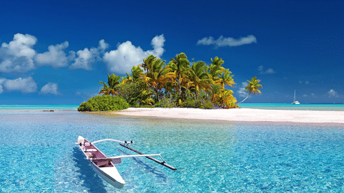 a canoe sailing towards an island with brown sand and blue sky in the background