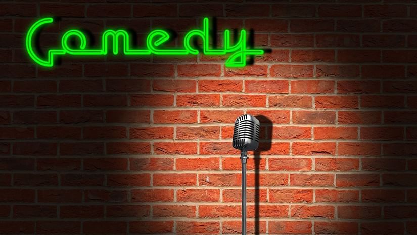 A mic and comedy sign at a comedy club