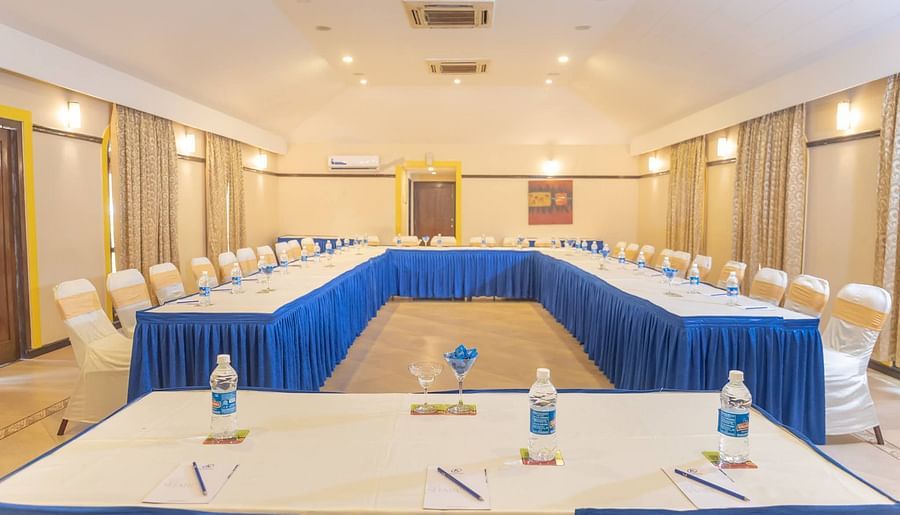Chairs set in a U-shaped seating at Opera Banquet Hall at Kyriad Prestige Calangute, Goa