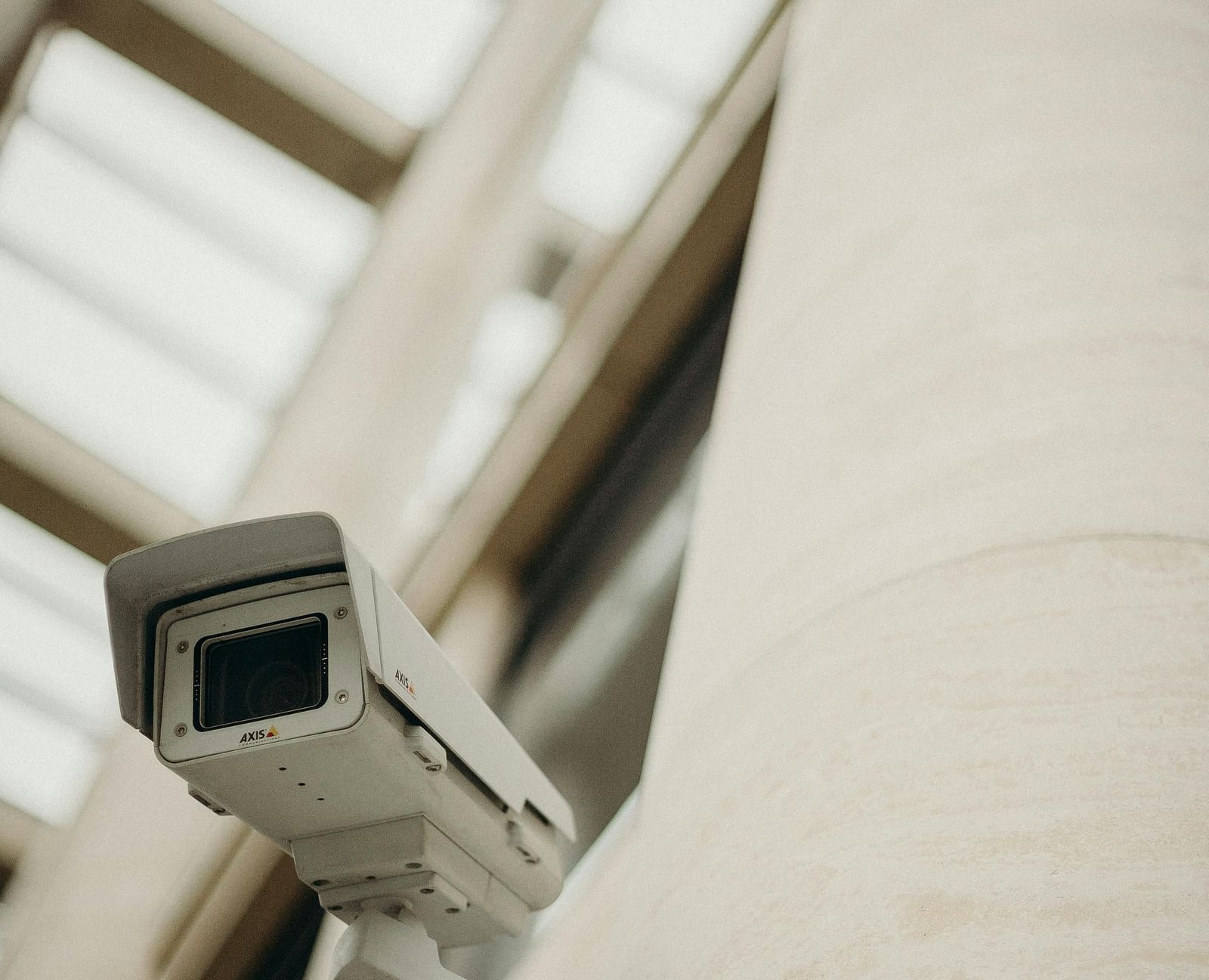 White survillence camera attached to a pole.