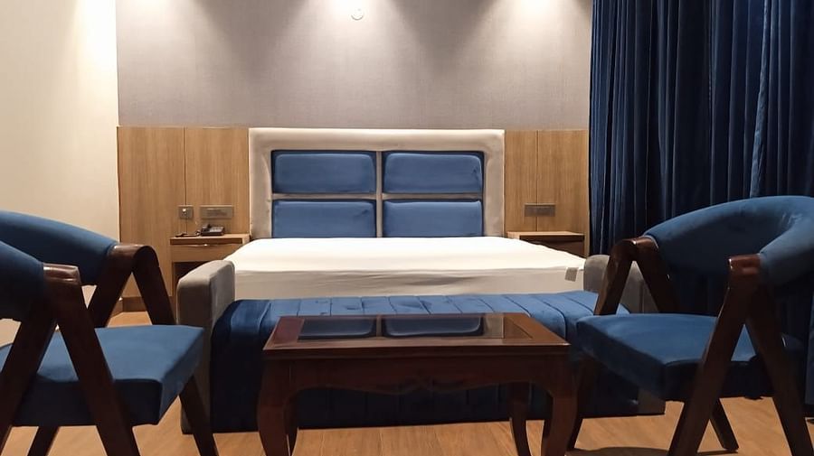 Lime Tree Banquet greater noida - superior king room bed with desk and chair