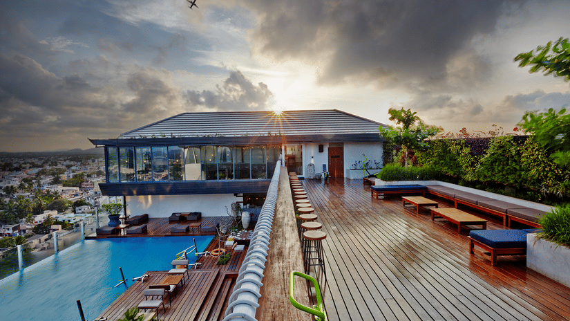 Facade of aqua gym at Hablis Hotel, Chennai, with the sun setting in the background.