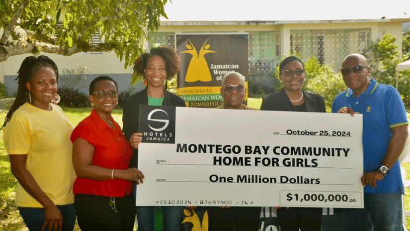 S Hotel Foundation representatives presenting a cheque donation to the Montego Bay Community Home for Girls, symbolising their focus on supporting safe spaces, care programmes, and youth empowerment in Jamaica.
