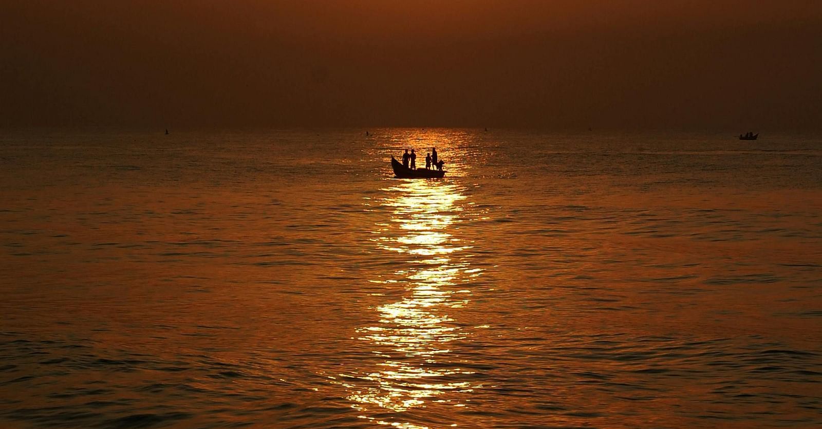 Scenic view of the beach at sunset.