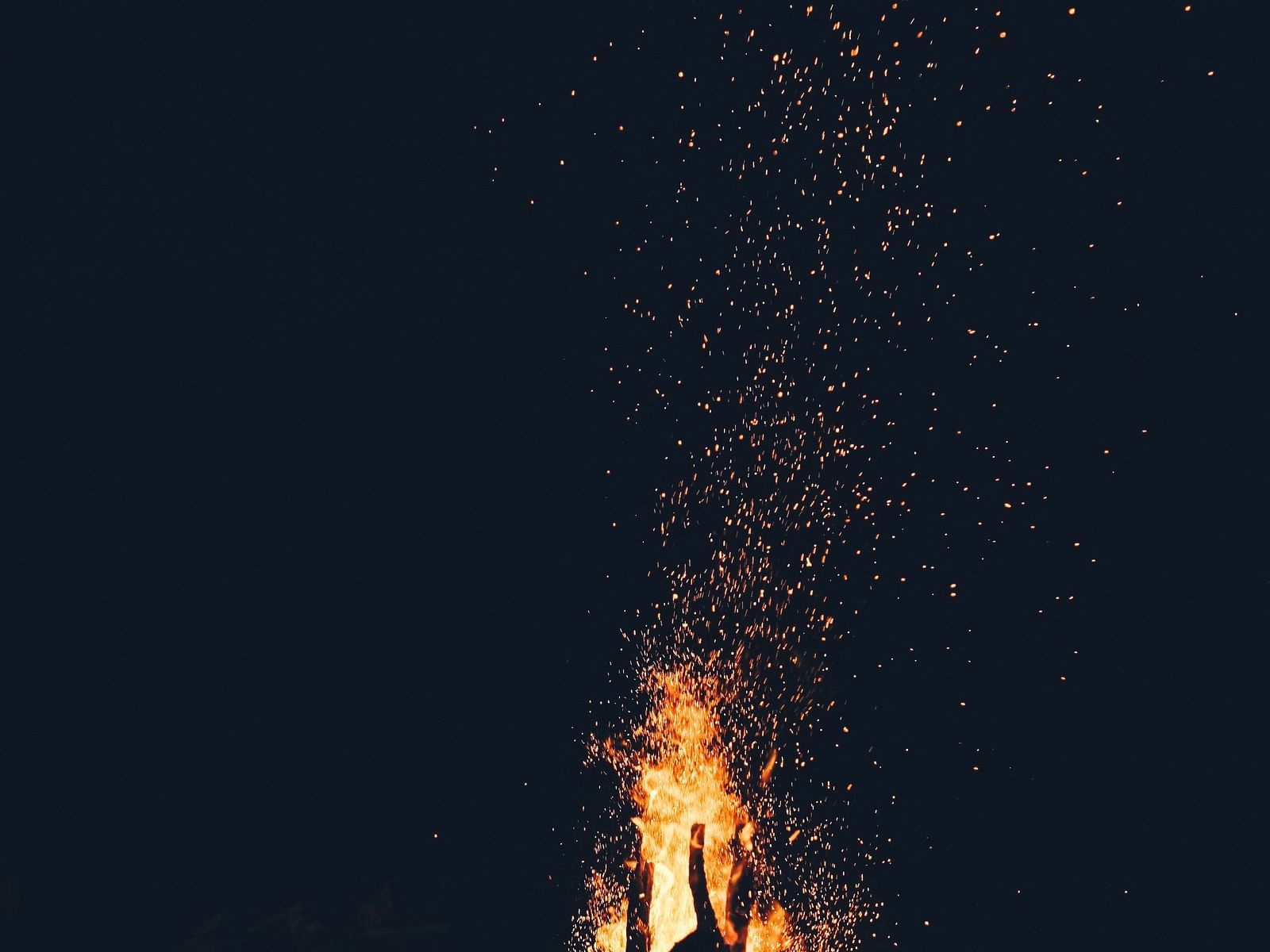 A campfire against the night sky