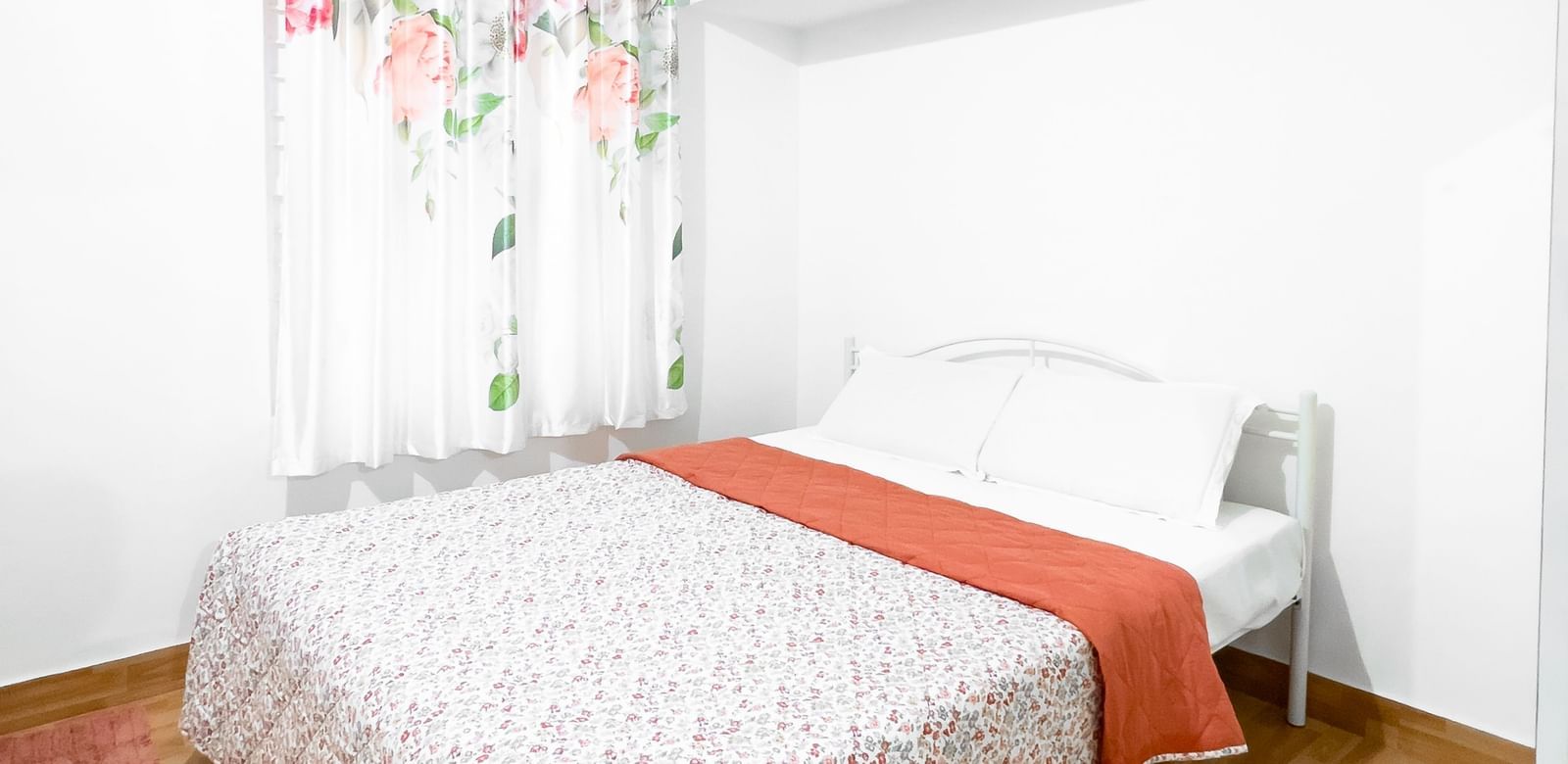 Bright bedroom with double bed and patterned bedspread at The Pinnacle, Electronic City.