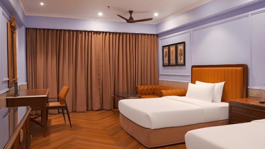 A room with twin beds, wooden herringbone flooring, brown curtains, a work desk and a chair, and wall arts at MAYFAIR Bay Resort, Paradeep.