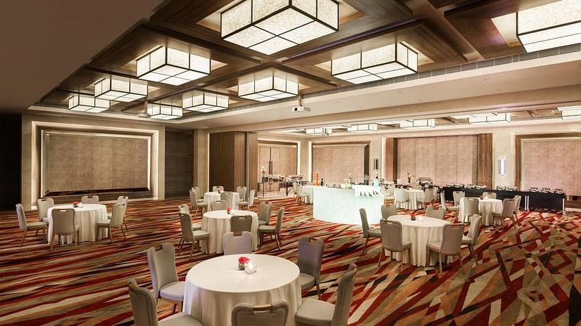 Dinner setup with a buffet and round tables at The Residency Towers Coimbatore