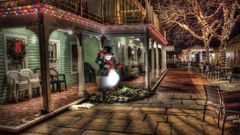 A cafe decorated with lights and a christmas tree