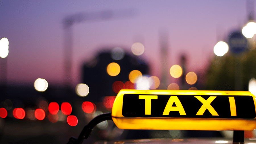 Image of a signage with taxi written on it.