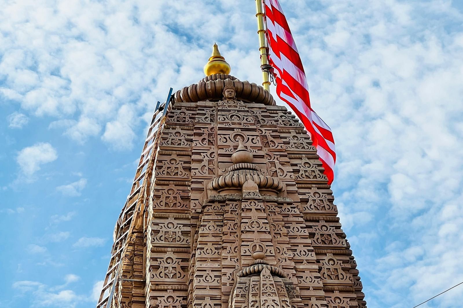 A temple top with a flag fixed at the top.