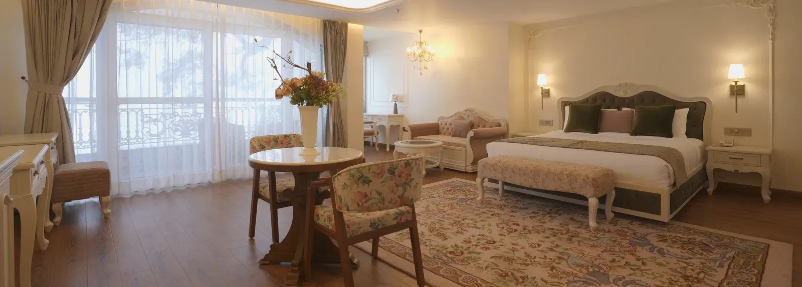 Spacious suite with queen size bed, wooden floors, and soft ceiling illumination - Mayfair Cafe & Suites, Dalhousie