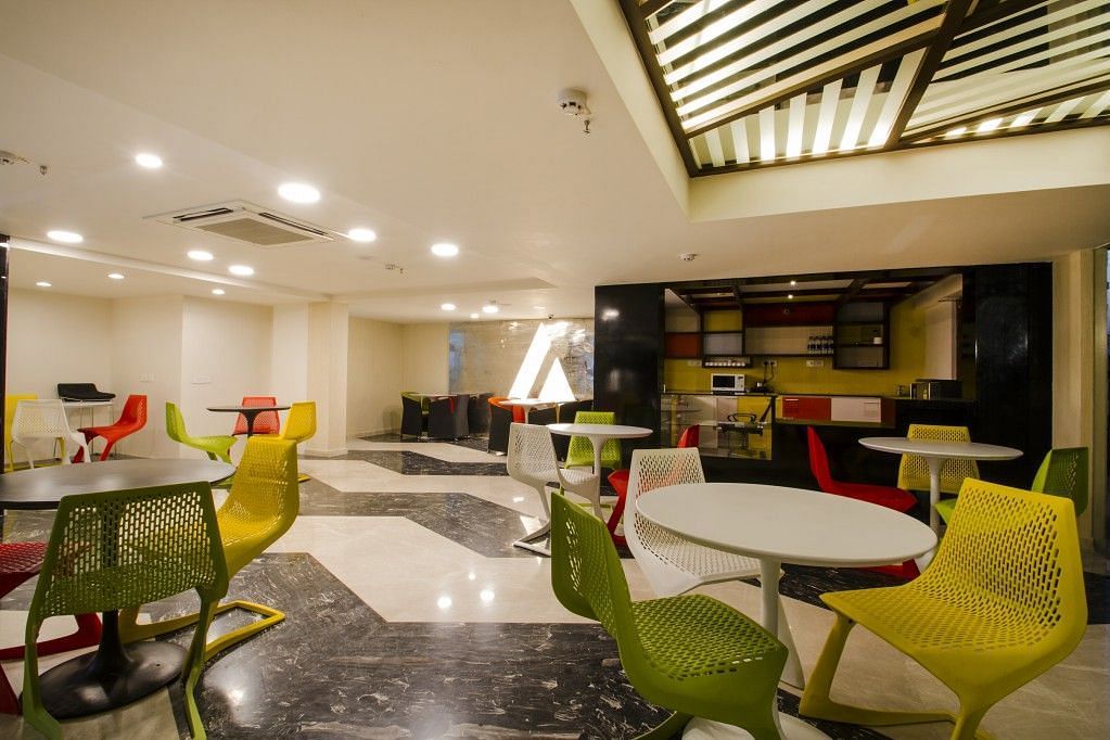 Dining area with tables and chiars at  Art Boutique Hotel, Hyderabad 