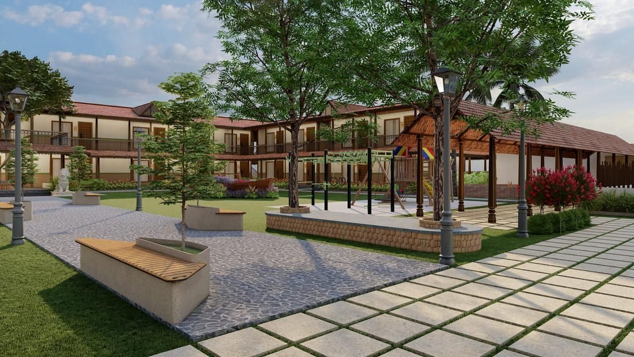 Exterior view of a resort building with a concrete seating area and landscaping | Ayana Resorts & Convention, Hyderabad
