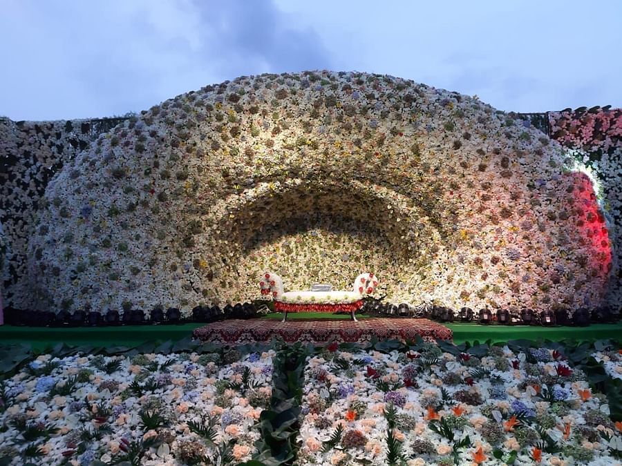 A customised stage decorated all-over with flowers at GK Hill View Resort.