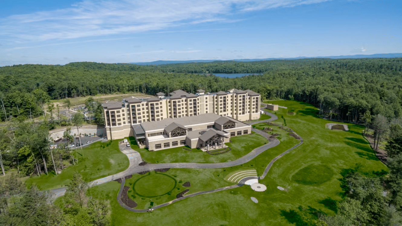 an extra long shot of the property with aerial view amidst the lush greenery