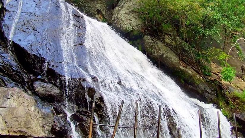  A close-up view of a powerful waterfall flowing over rocks.