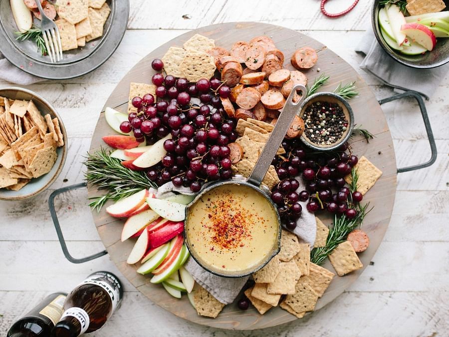 a plate with food and dips