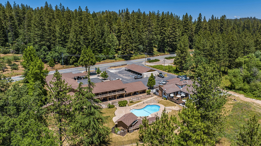 Aerial view of Amador Hotel with a forest in the backdrop.