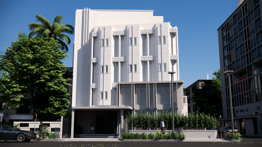A 5-storey white Shilton Suites, Bengaluru's building with vertical architectural details and green landscape under a blue sky.