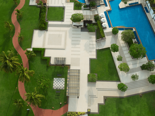 an aerial view of Kenilworth Resort & Spa, Goa with the swimming pool next to it
