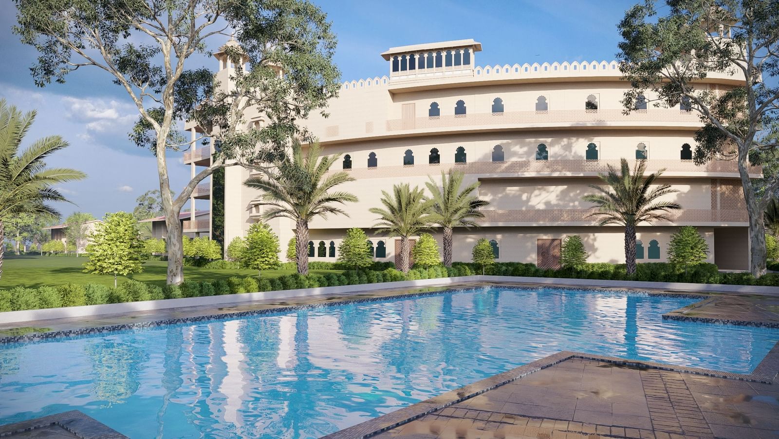 Bamboo Saa Sunrrise Wedding & Wellness Resort, Jaipur, with an outdoor swimming pool and sun loungers in a sunny setting.