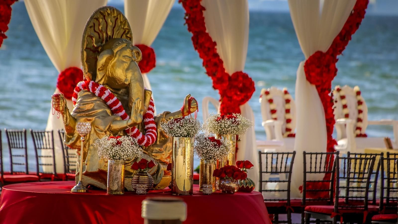 Red & White themed event by the beach - Rhythm Kumarakom
