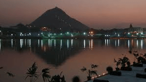 Savitri Temple's reflection lights up the lake in Pushkar 