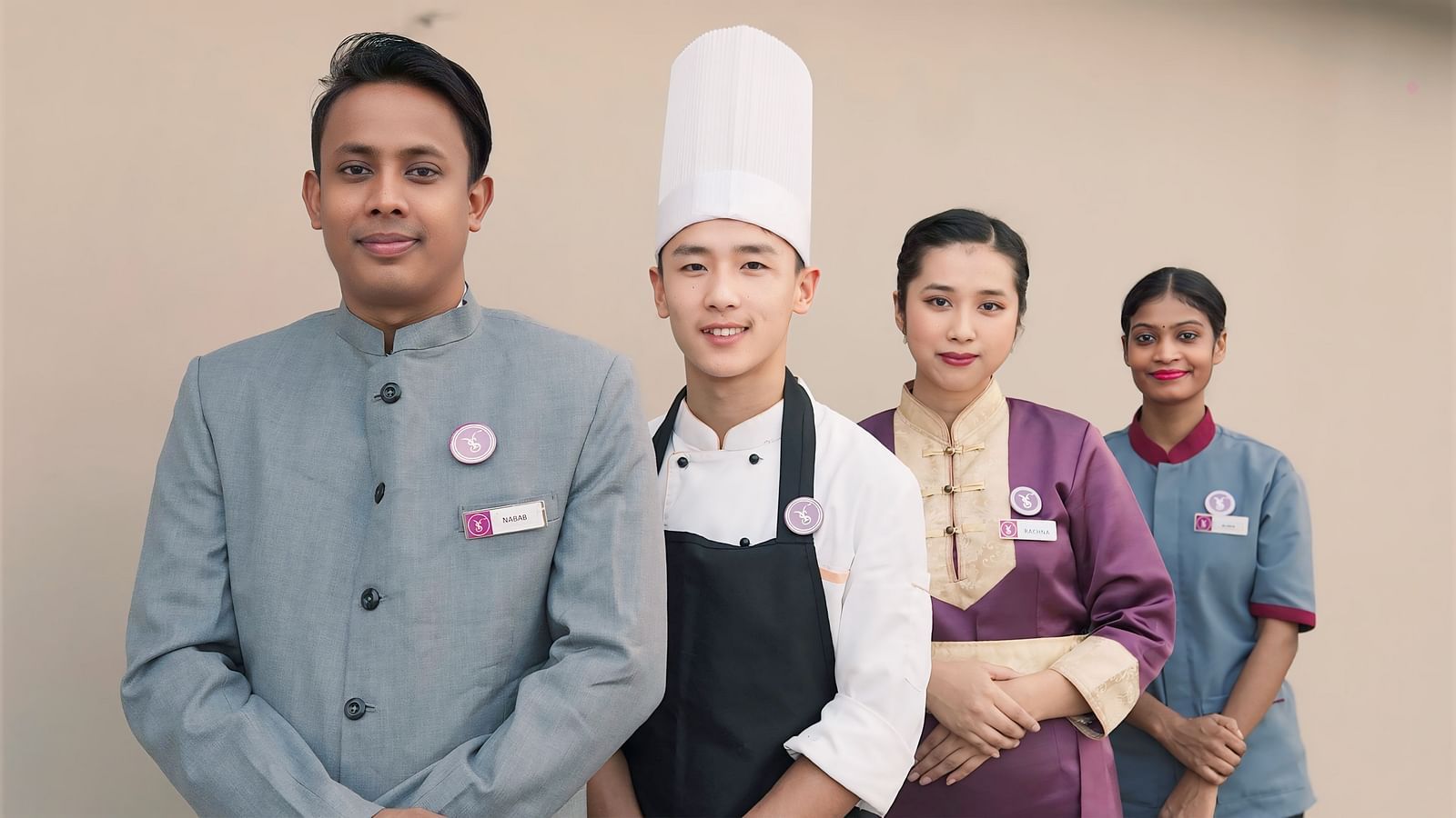 An image of four with different attires dressed according to their job roles - Sumi Yashshree Hotels & Resorts