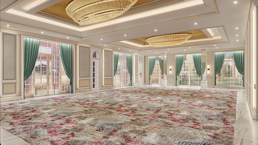 A spacious banquet hall with colourful carpeting, large windows, and modern design, perfect for events - Sarovar Premiere Amritsar