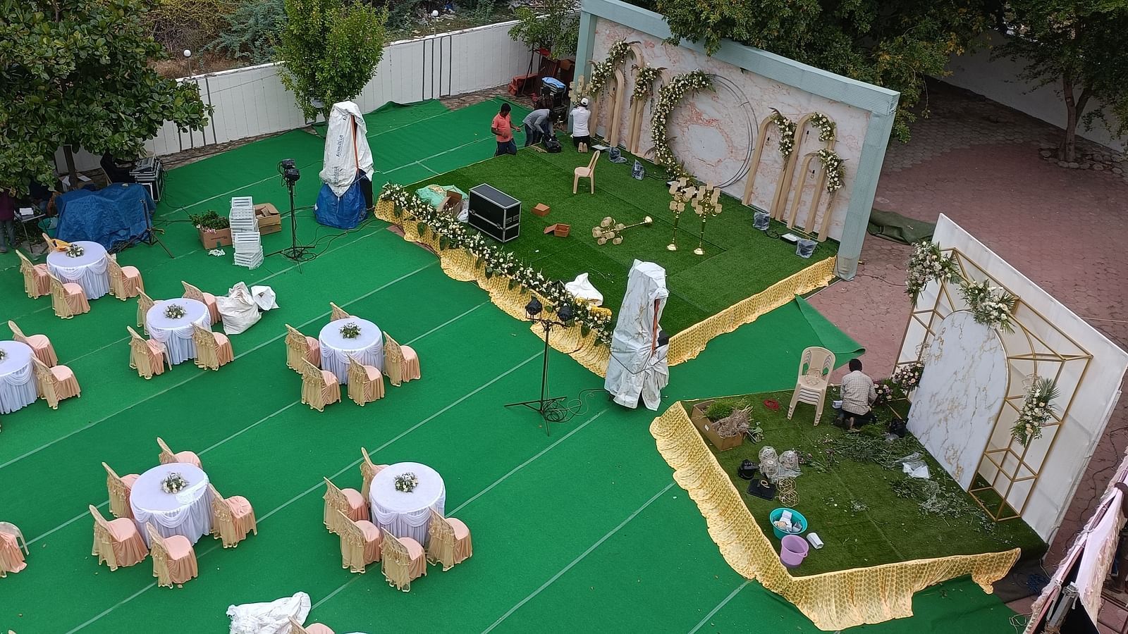 An aerial shot of Starlight Garden, our thoothukudi marriage hall, featuring round tables with chairs placed around them - Regency Tuticorin by GRT Hotels