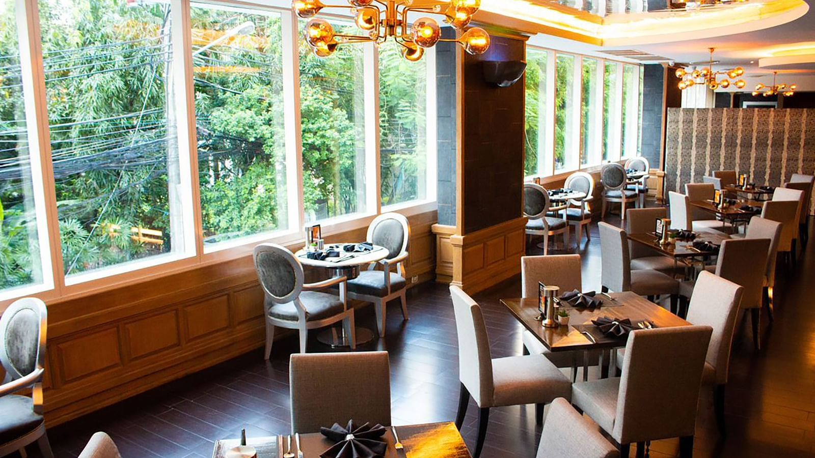 An overview of the seating arrangement inside Flava Restaurant at Night Hotel Bangkok.