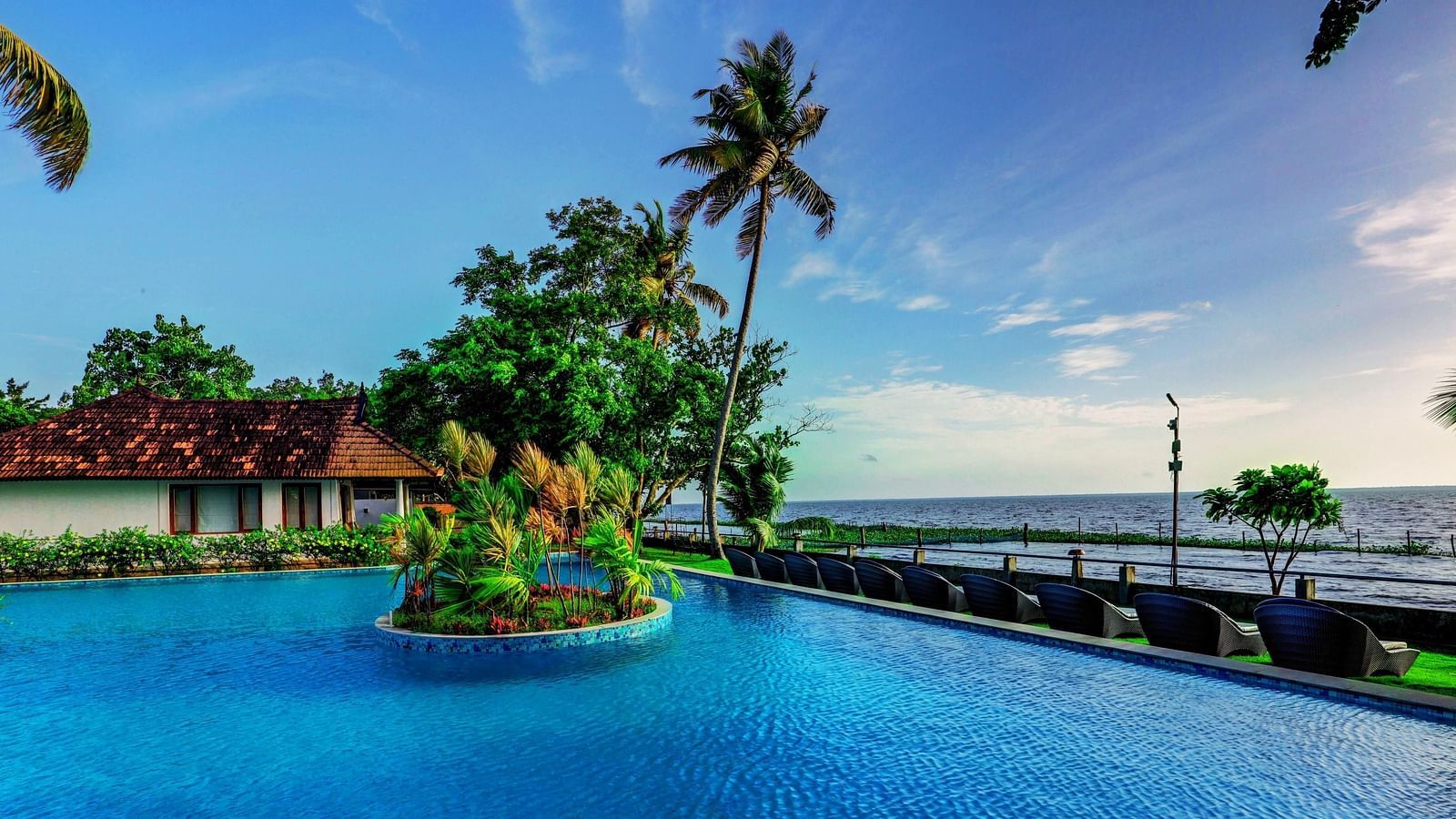 an image of a Crystal clear blue waters in the swimming pool - Rhythm Kumarakom