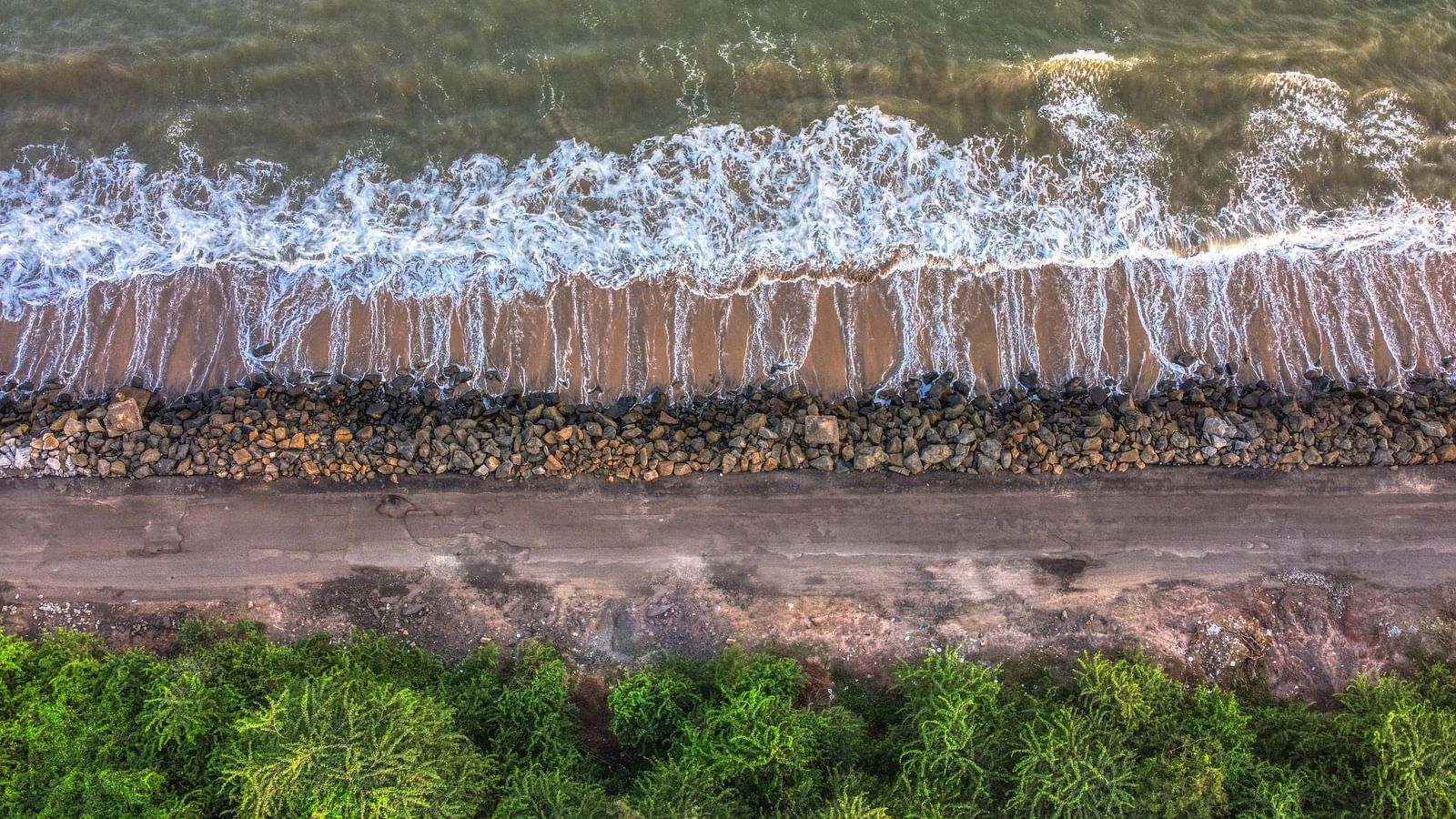 An image of Kakinada Beach with waves moving away from the shore